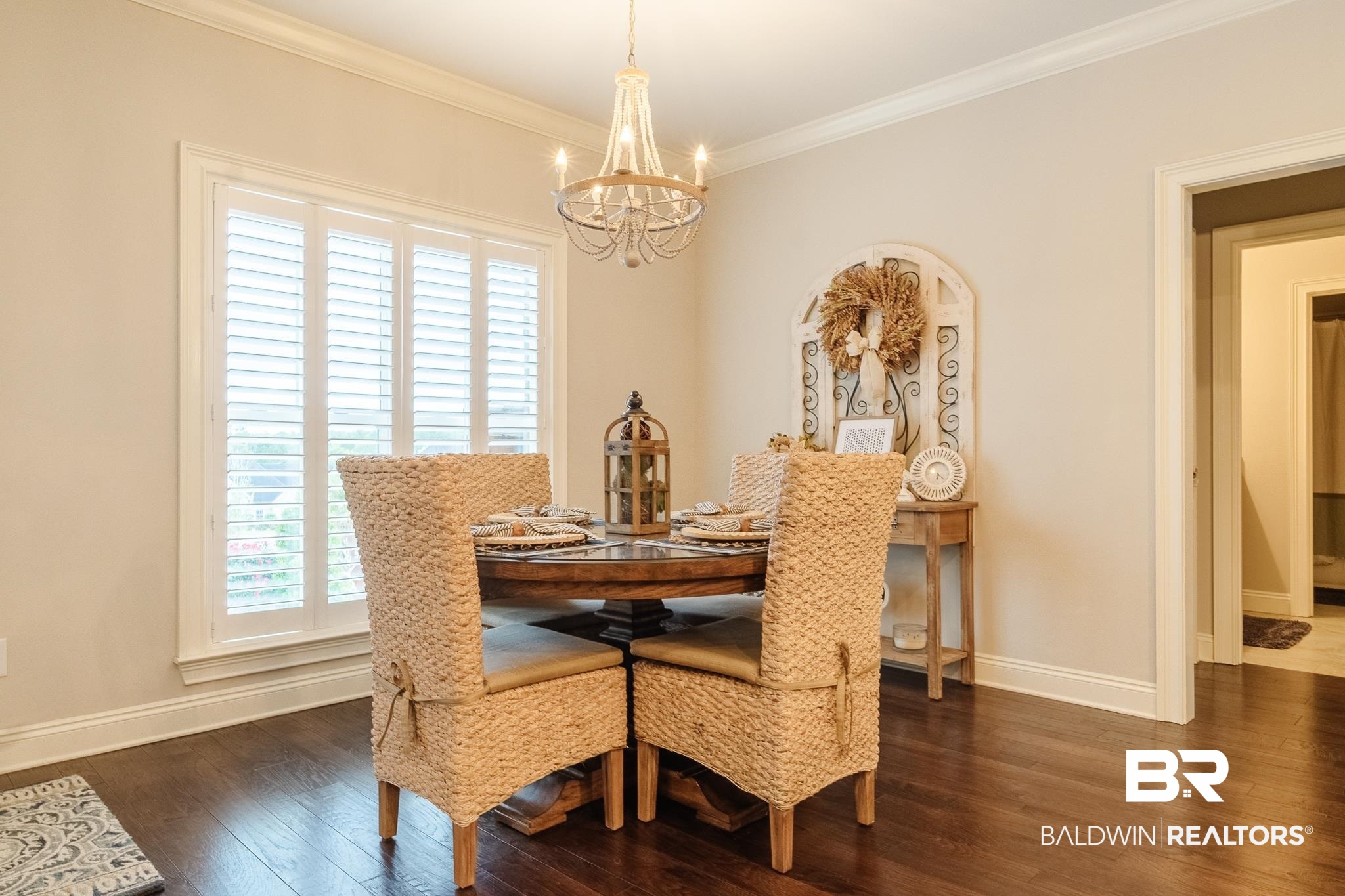 7235 Raleigh Way Mobile, AL 36695 - Photo 8 of 52 Dining space featuring baseboards, a notable chandelier, crown molding, and wood finished floors