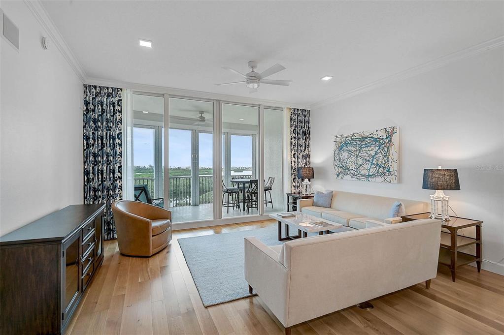 409 North Point Road, Unit 802 Osprey, FL 34229 - Photo 1 of 38 a living room with furniture and a large window