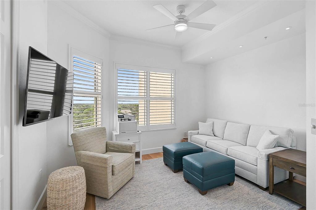 409 North Point Road, Unit 802 Osprey, FL 34229 - Photo 15 of 38 a living room with furniture and a large window