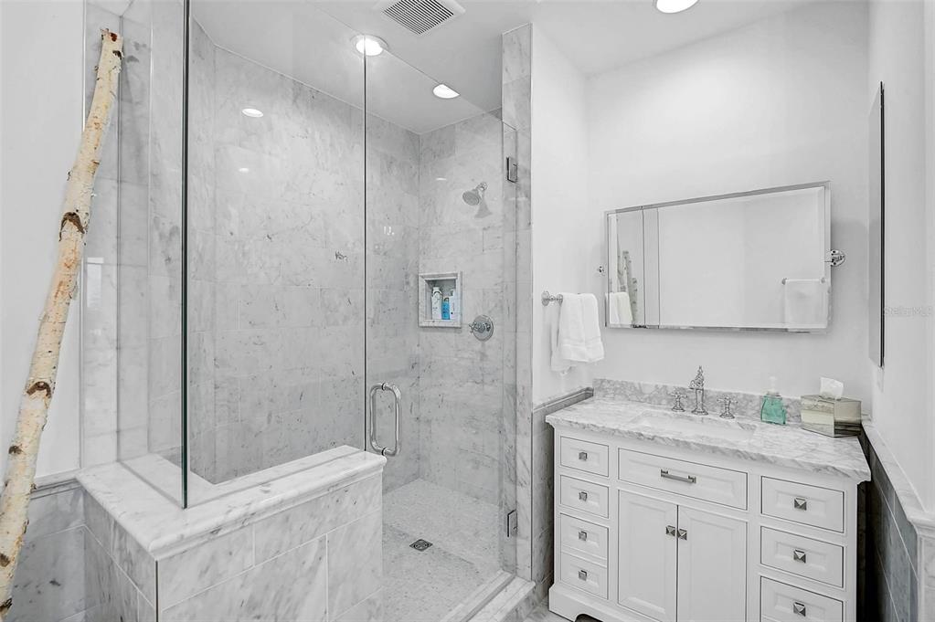 409 North Point Road, Unit 802 Osprey, FL 34229 - Photo 22 of 38 a bathroom with a granite countertop sink a mirror a shower and a mirror