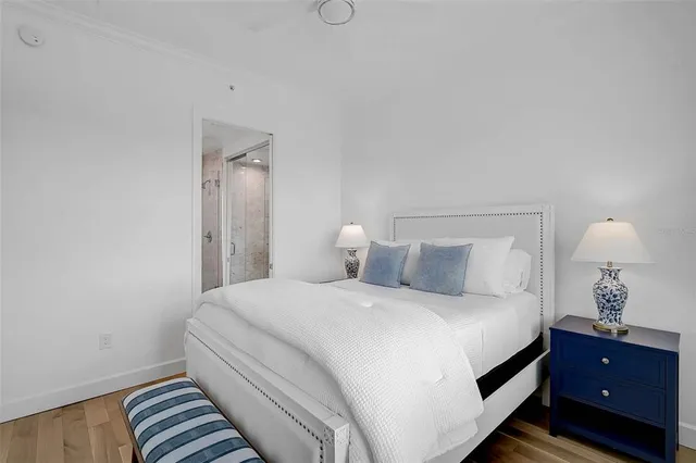 a bedroom with a lamp and lamp