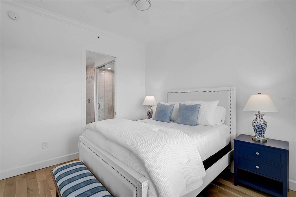 409 North Point Road, Unit 802 Osprey, FL 34229 - Photo 26 of 38 a bedroom with a lamp and lamp