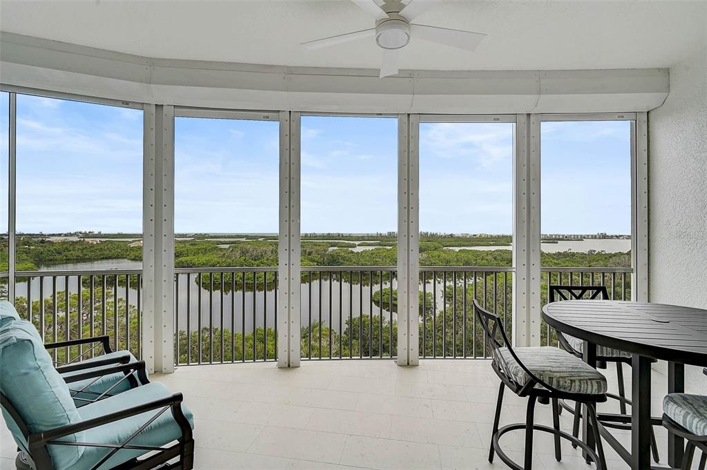 409 North Point Road, Unit 802 Osprey, FL 34229 - Photo 29 of 38 a view of a city from a dining room with a floor to ceiling window