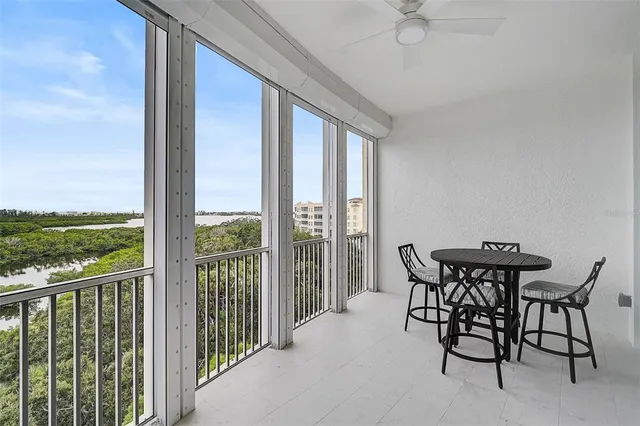 a view of a patio with a table and chairs