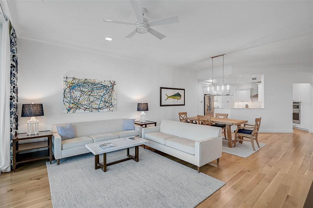 409 North Point Road, Unit 802 Osprey, FL 34229 - Photo 9 of 38 a living room with furniture and a wooden floor