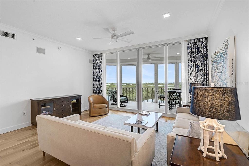 409 North Point Road, Unit 802 Osprey, FL 34229 - Photo 10 of 38 a living room with furniture and a large window