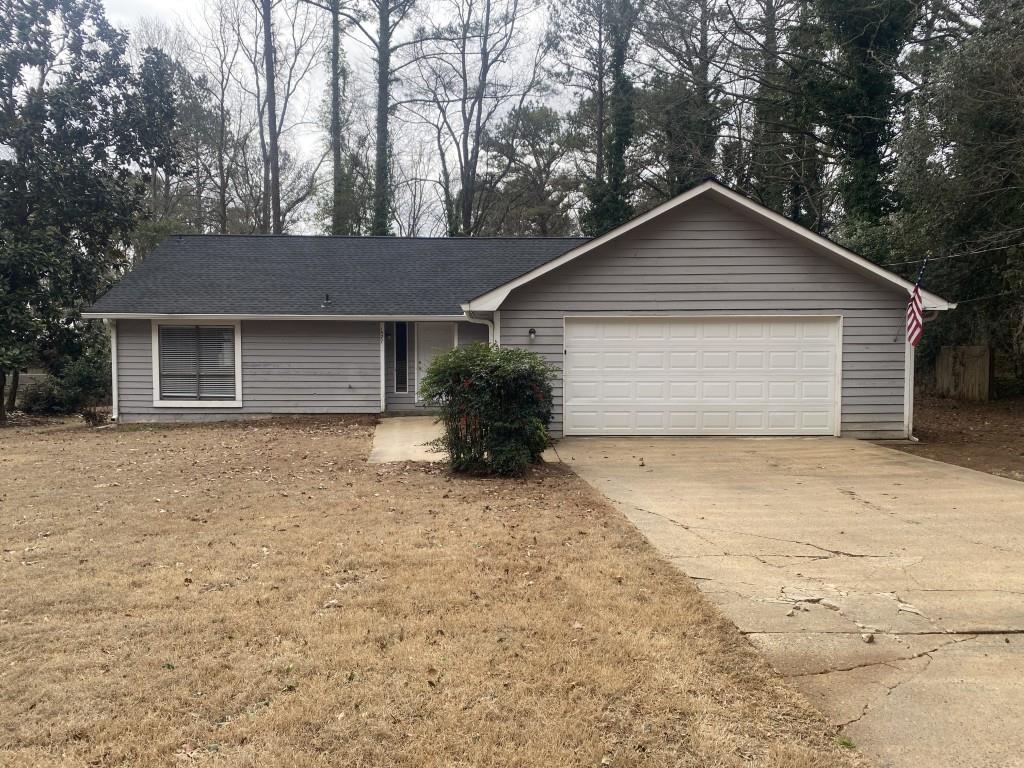 1527 Flat Rock Road Stockbridge, GA 30281 - Photo 1 of 1 a house with trees in the background