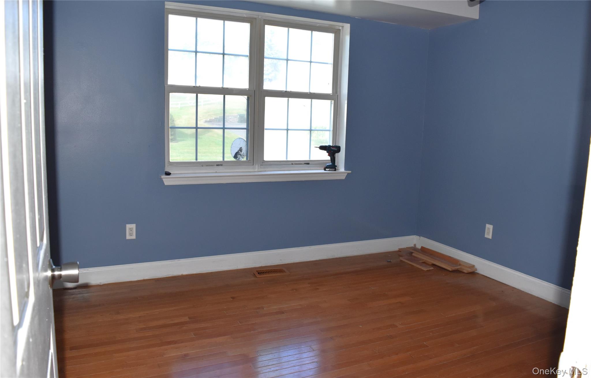 21 Walden Estates Road Walden, NY 12586 - Photo 15 of 32 Unfurnished room with baseboards and dark wood-type flooring
