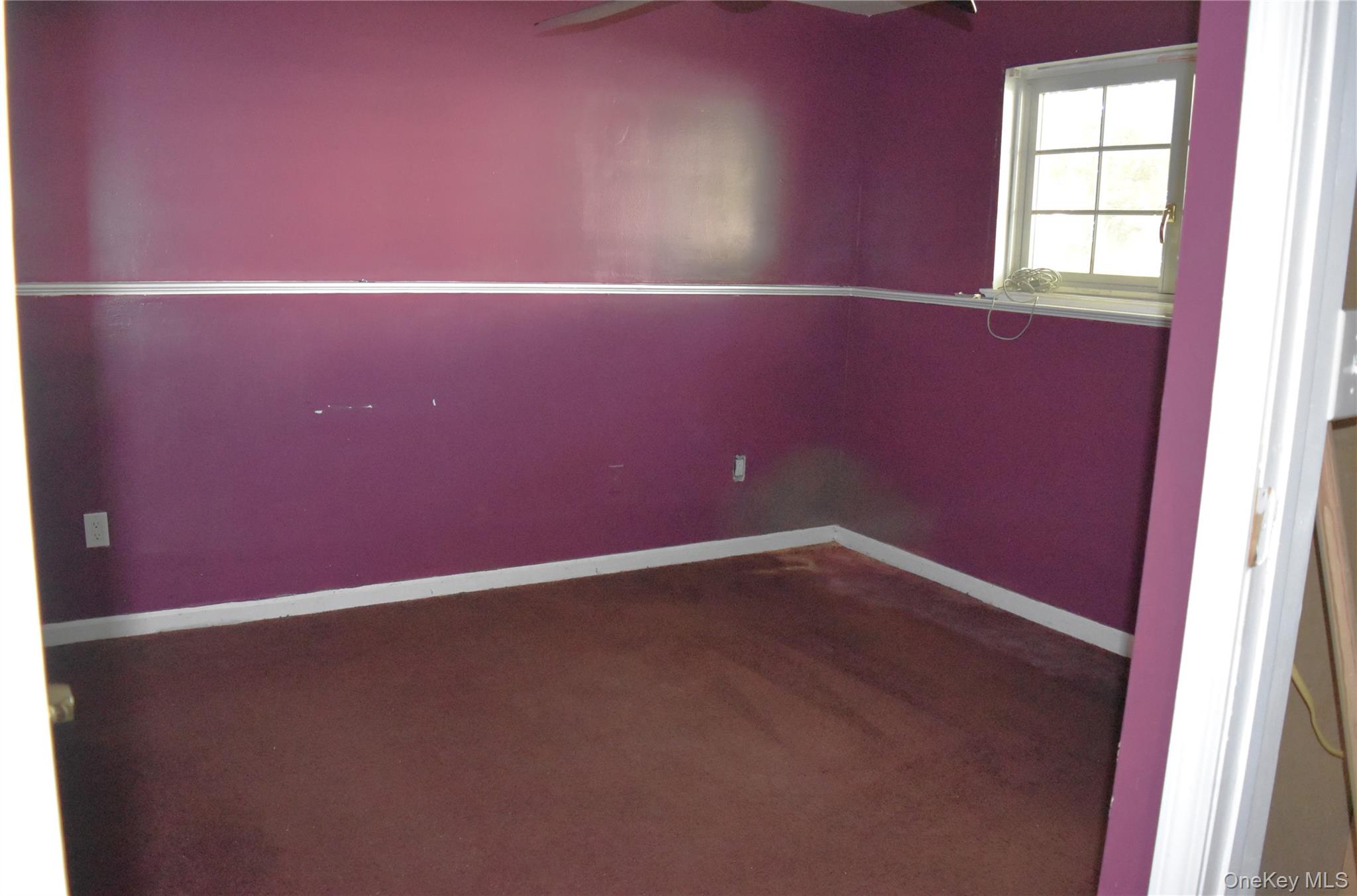 21 Walden Estates Road Walden, NY 12586 - Photo 18 of 32 Empty room featuring a ceiling fan and dark carpet