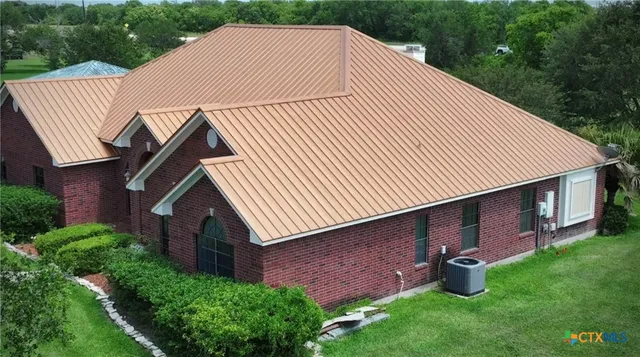 a kitchen with stainless steel appliances granite countertop a stove a sink dishwasher and cabinets with wooden floor