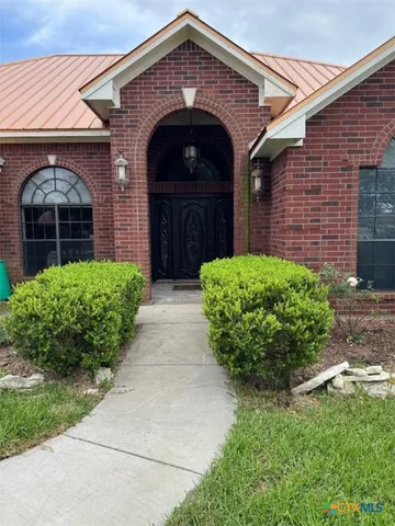 a view of a pathway with a patio
