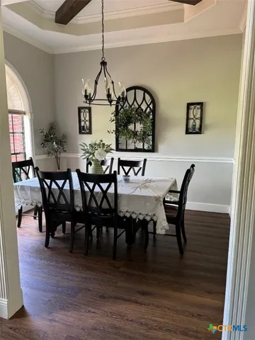 a bathroom with a sink a vanity and a large mirror