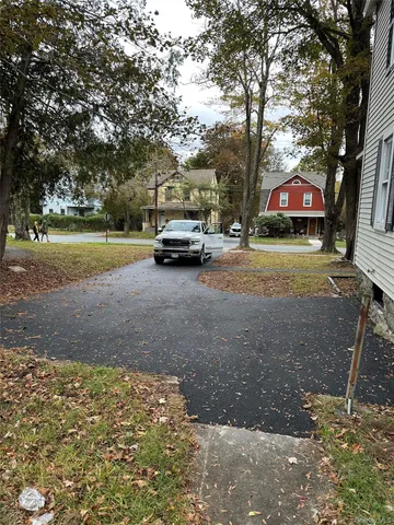 a view of street with parked cars