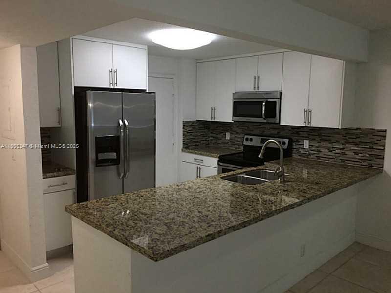 9001 Southwest 77th Avenue, Unit C308 Miami, FL 33156 - Photo 5 of 27 Exterior Front