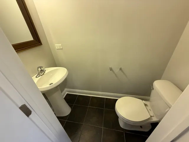 a bathroom with a toilet and a sink