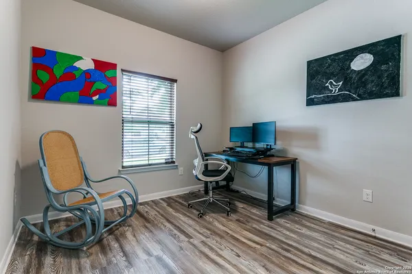 a workspace with furniture and a window