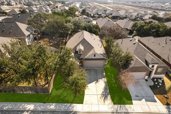 an aerial view of house with yard