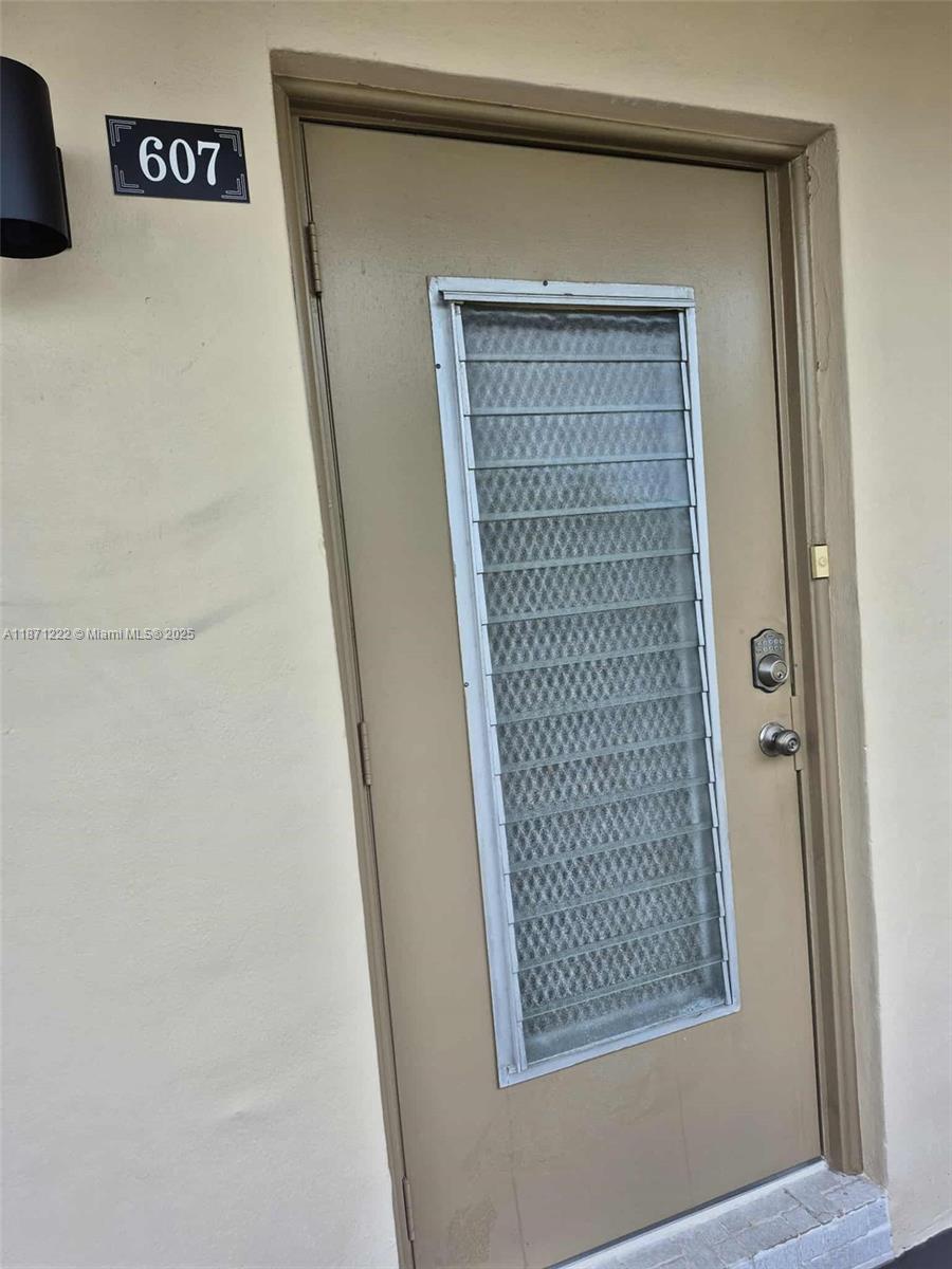 3400 Northwest 48th Avenue, Unit 607 Lauderdale Lakes, FL 33319 - Photo 13 of 17 a view of front door