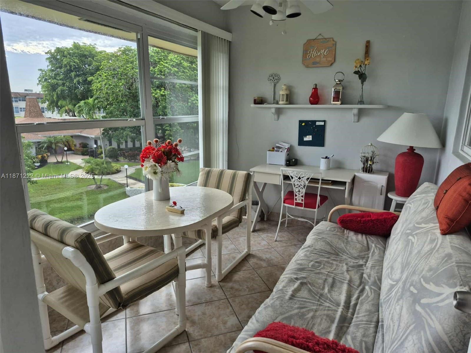 3400 Northwest 48th Avenue, Unit 607 Lauderdale Lakes, FL 33319 - Photo 7 of 17 a living room with furniture and a table