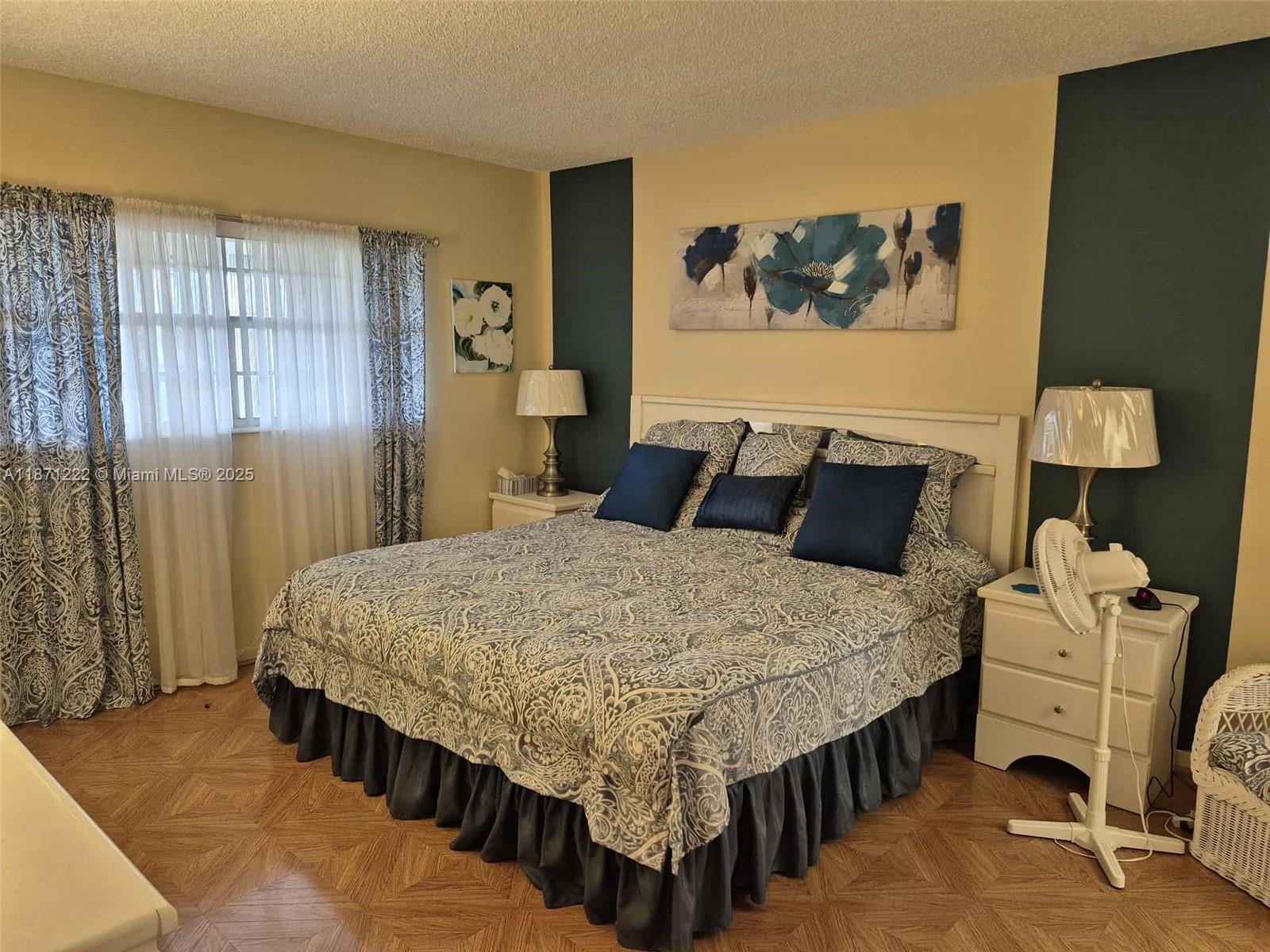 3400 Northwest 48th Avenue, Unit 607 Lauderdale Lakes, FL 33319 - Photo 8 of 17 a bedroom with a bed and dresser