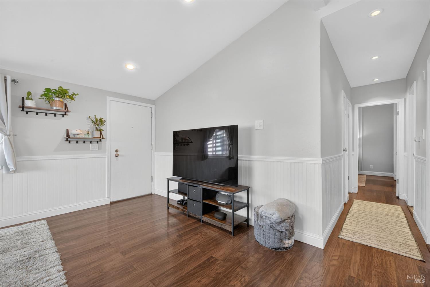 109 Pear Lane, Unit 109 Santa Rosa, CA 95407 - Photo 13 of 27 a living room with furniture and a flat screen tv