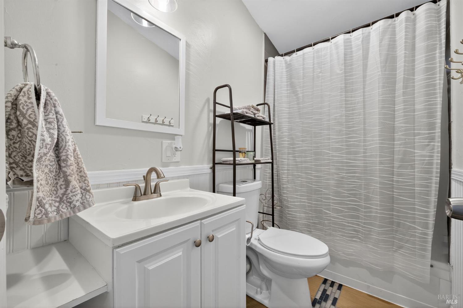 109 Pear Lane, Unit 109 Santa Rosa, CA 95407 - Photo 15 of 27 a bathroom with a sink toilet and mirror