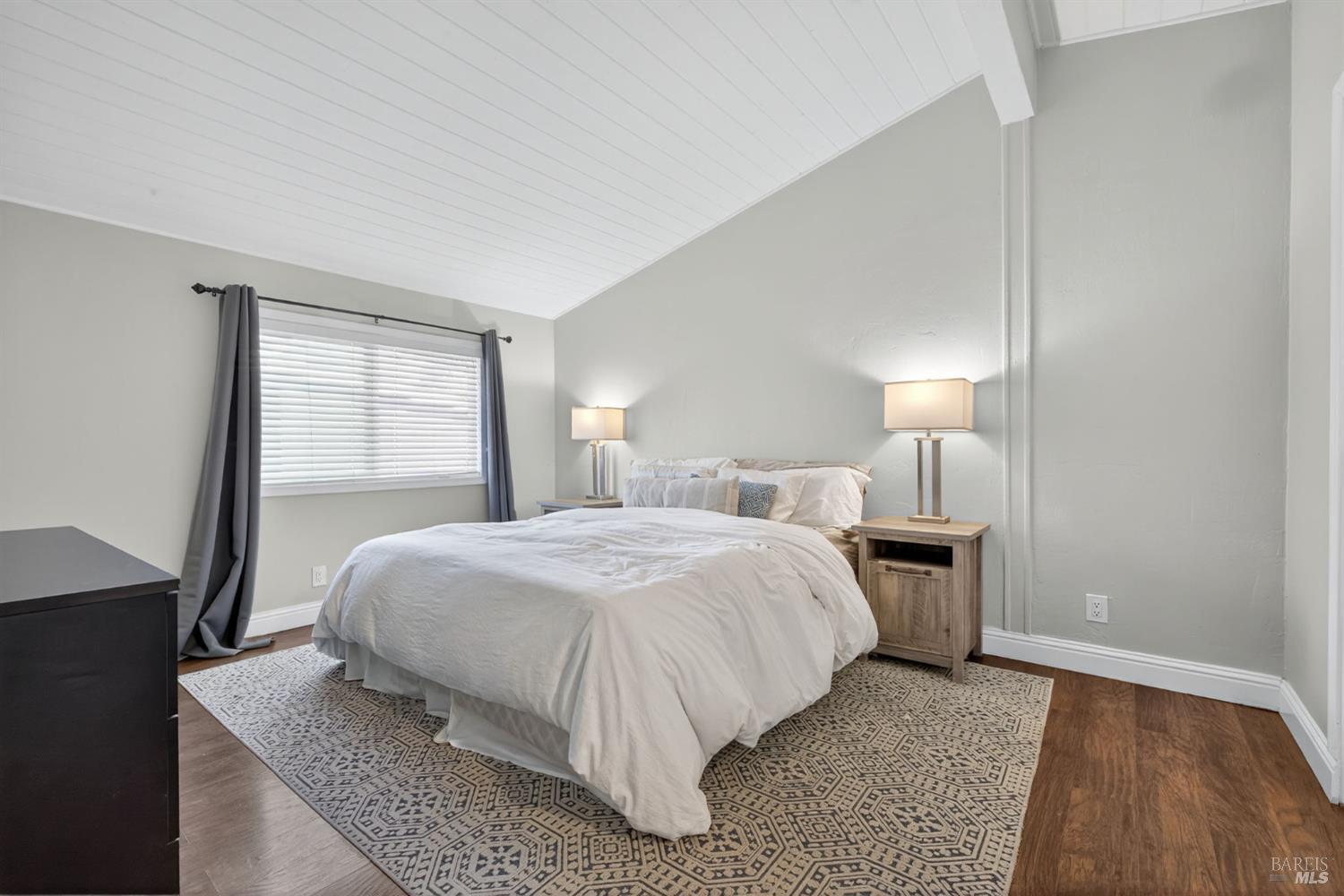 109 Pear Lane, Unit 109 Santa Rosa, CA 95407 - Photo 16 of 27 a bed room with a bed and a night stand