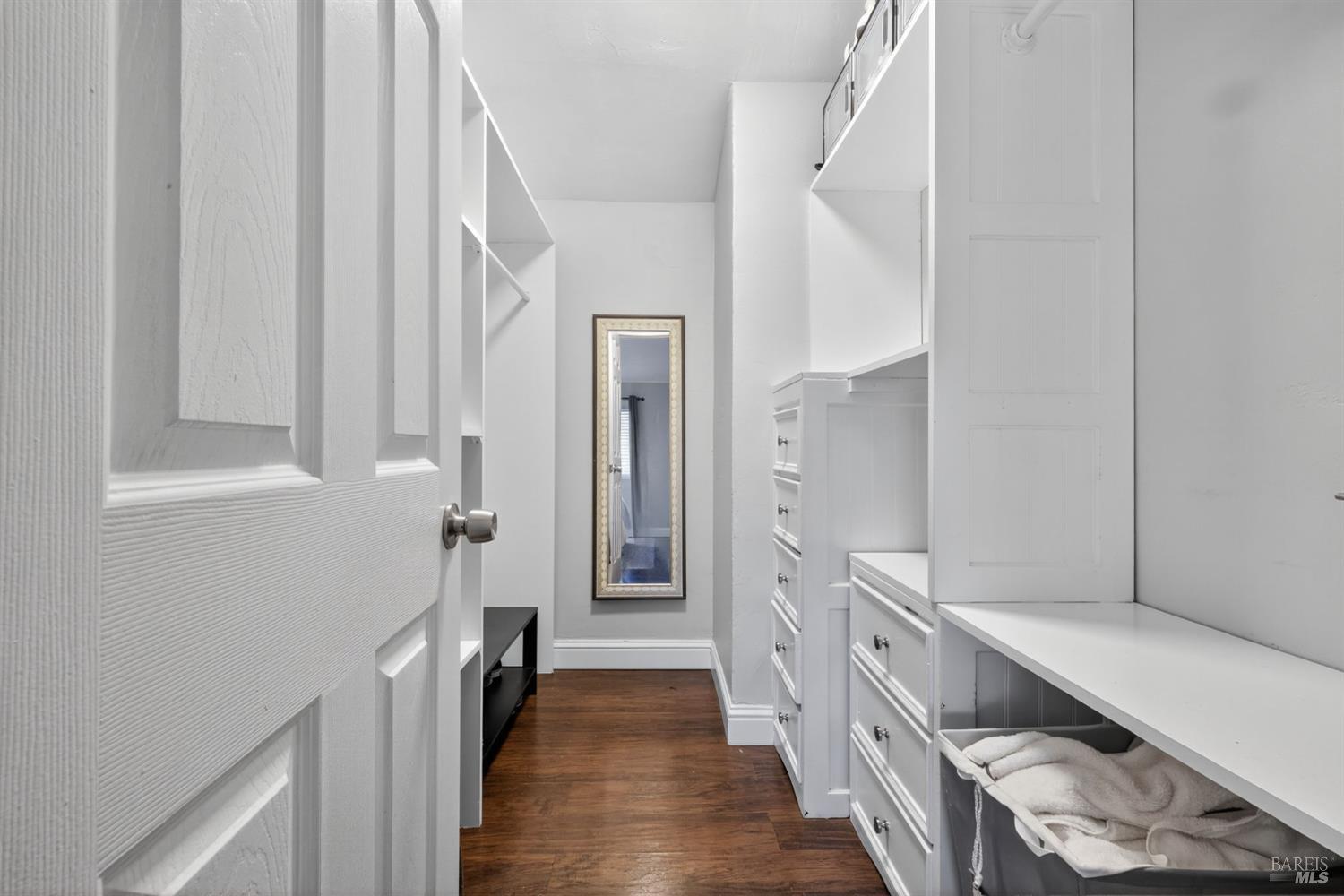 109 Pear Lane, Unit 109 Santa Rosa, CA 95407 - Photo 17 of 27 a room with a white cabinets and a wooden floor