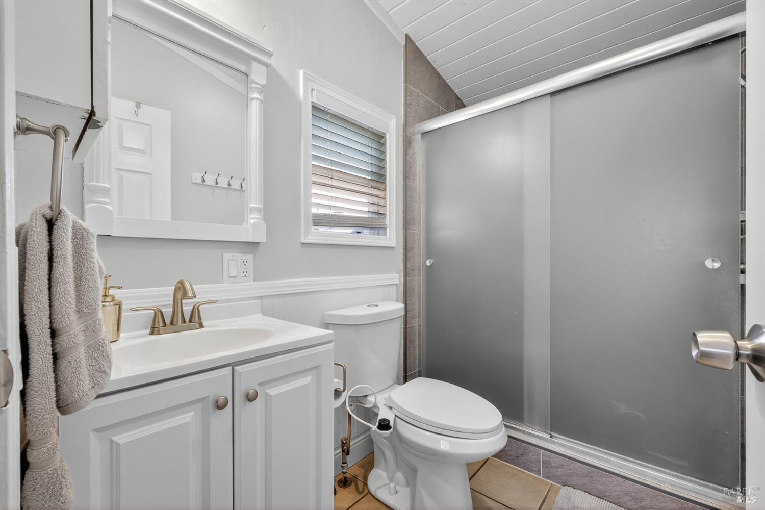 109 Pear Lane, Unit 109 Santa Rosa, CA 95407 - Photo 18 of 27 a bathroom with a sink toilet and vanity
