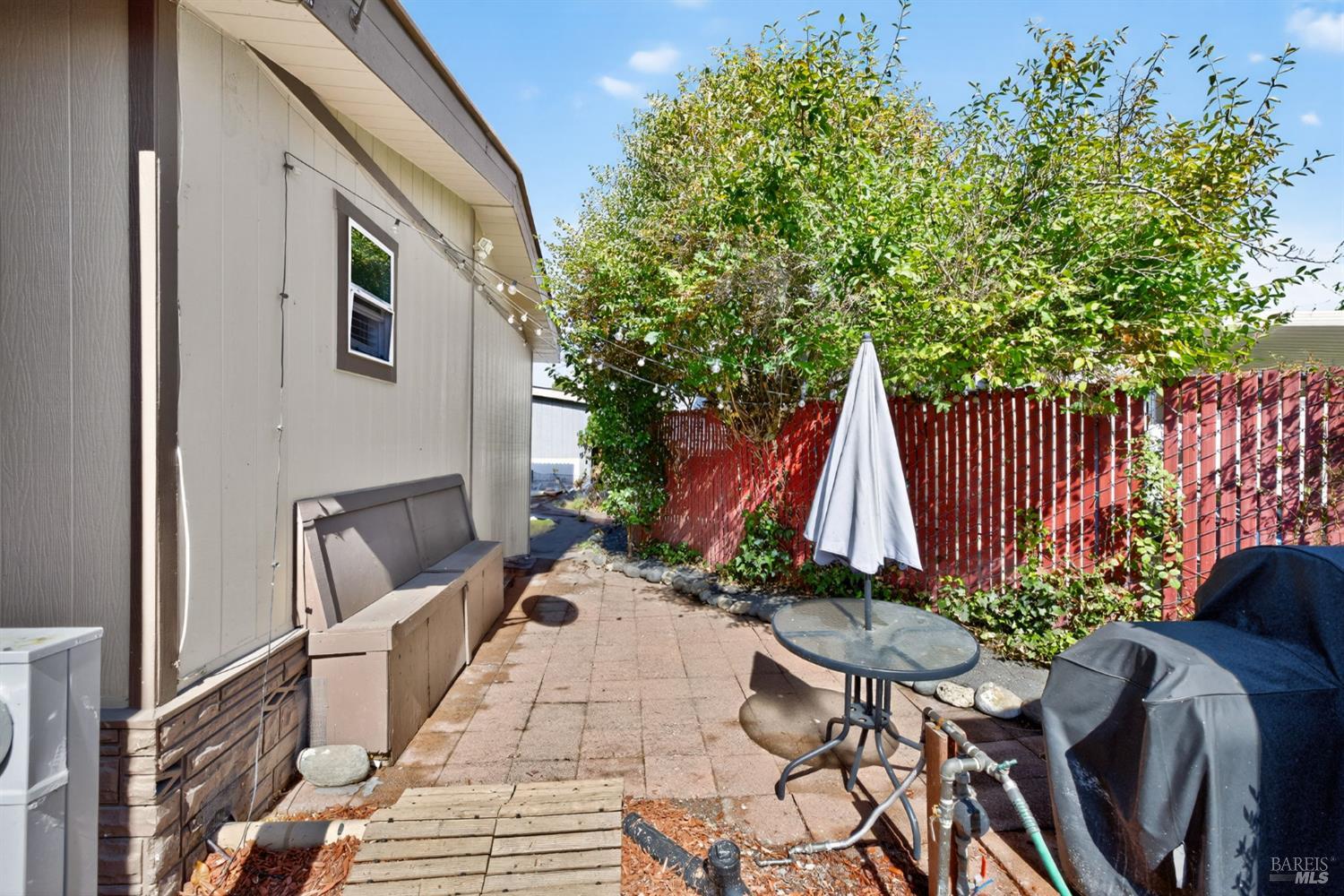 109 Pear Lane, Unit 109 Santa Rosa, CA 95407 - Photo 20 of 27 a view of backyard with table and chairs and potted plants