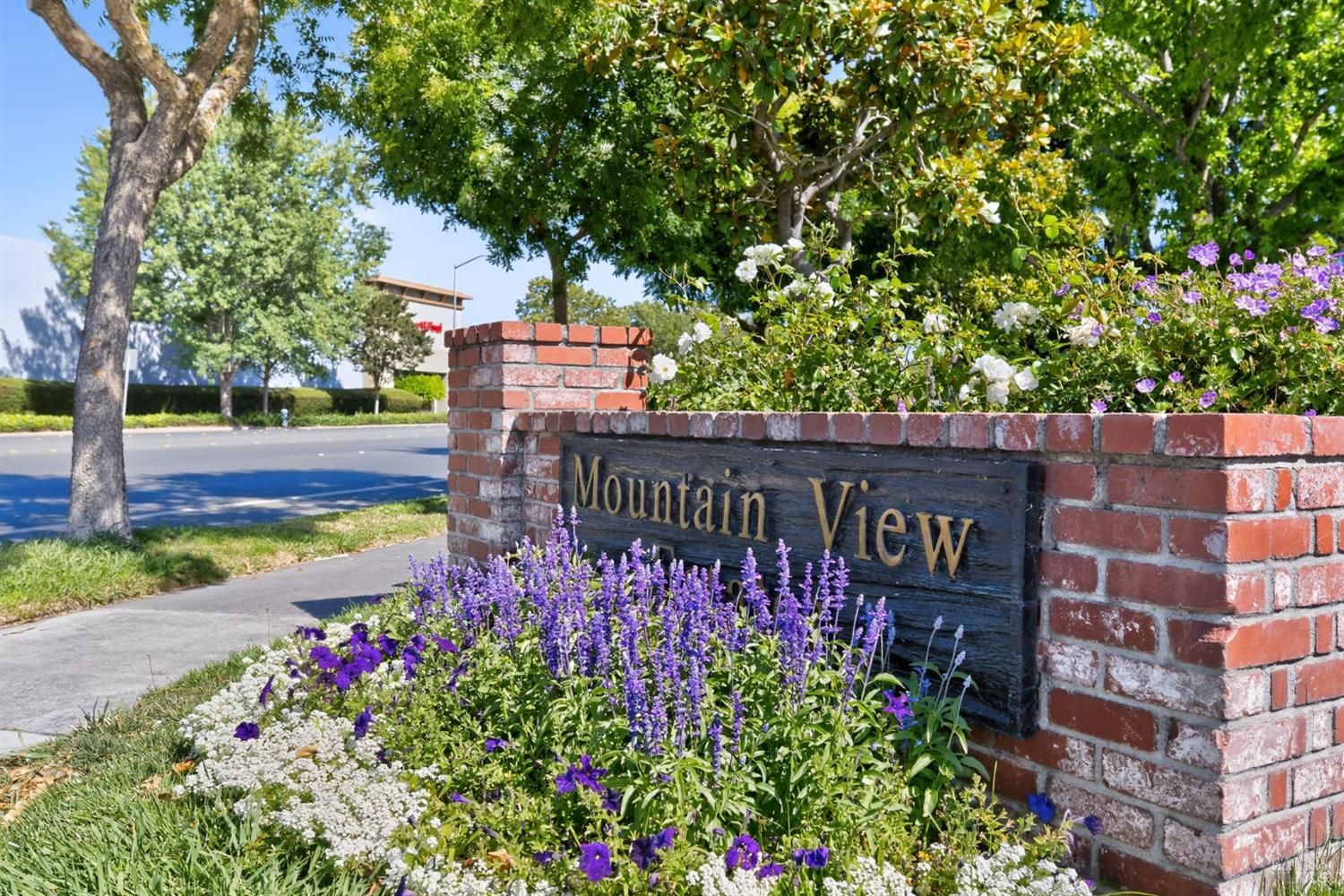 109 Pear Lane, Unit 109 Santa Rosa, CA 95407 - Photo 27 of 27 a sign that is in front of flowers