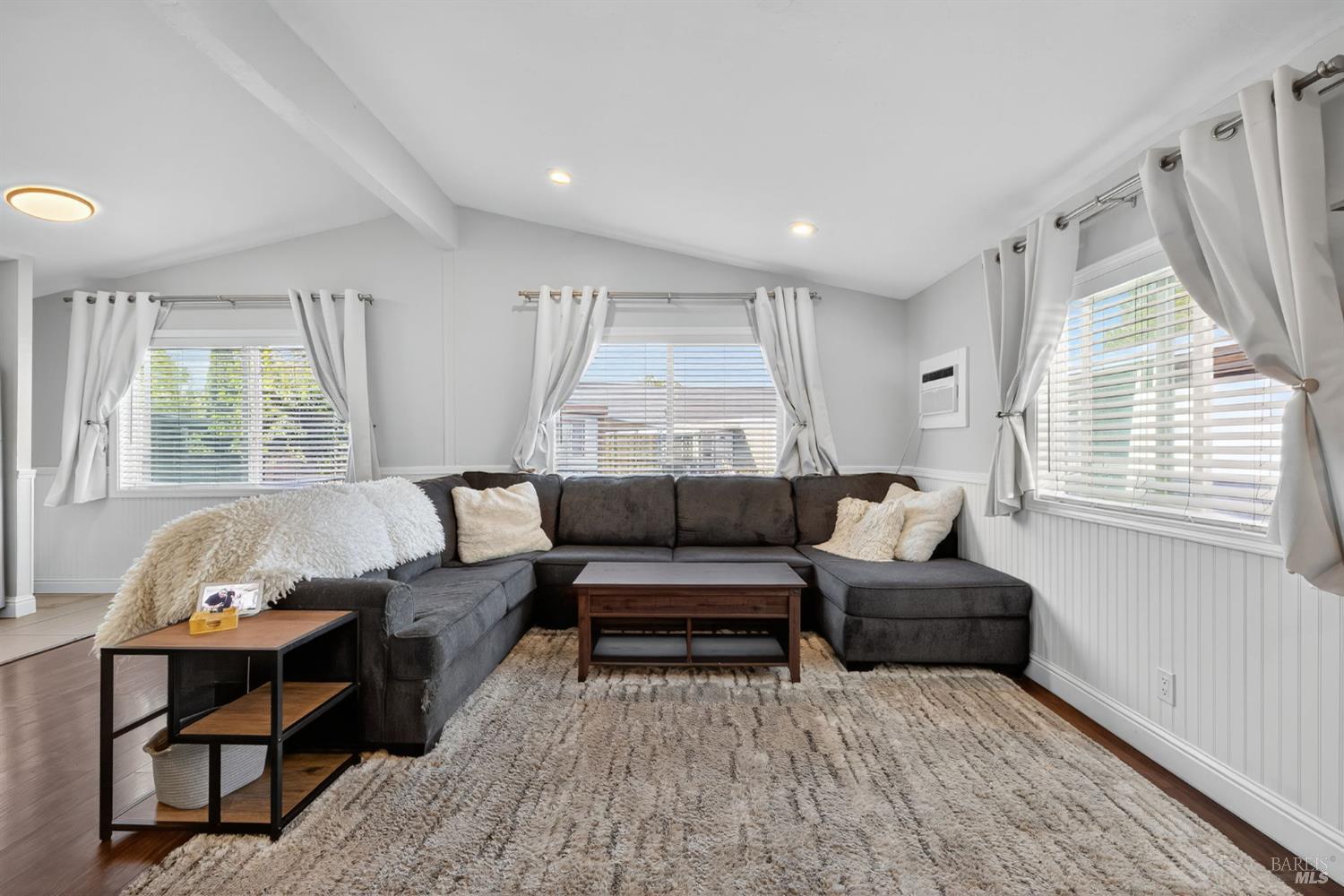 109 Pear Lane, Unit 109 Santa Rosa, CA 95407 - Photo 3 of 27 a living room with furniture and a large window