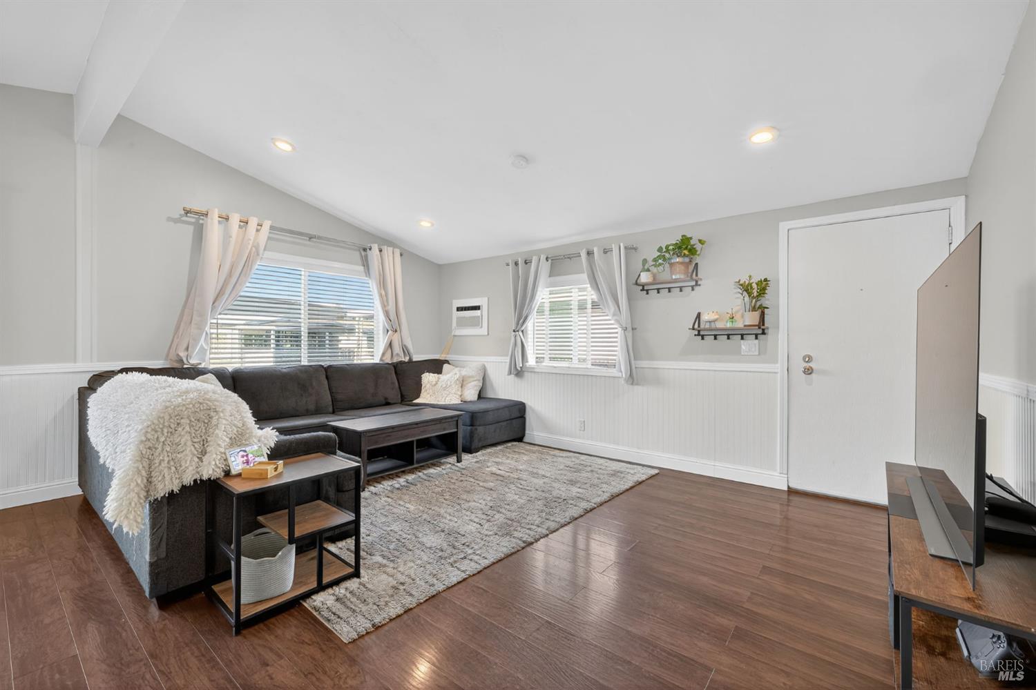 109 Pear Lane, Unit 109 Santa Rosa, CA 95407 - Photo 4 of 27 a living room with furniture and a flat screen tv