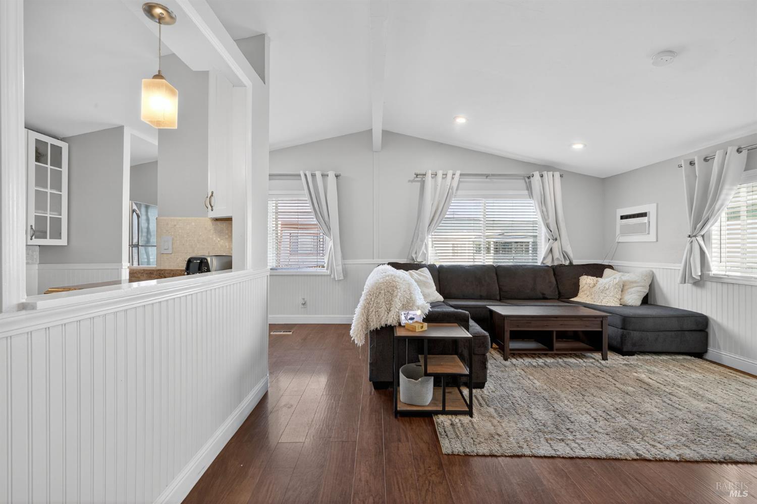 109 Pear Lane, Unit 109 Santa Rosa, CA 95407 - Photo 6 of 27 a living room with furniture and a wooden floor
