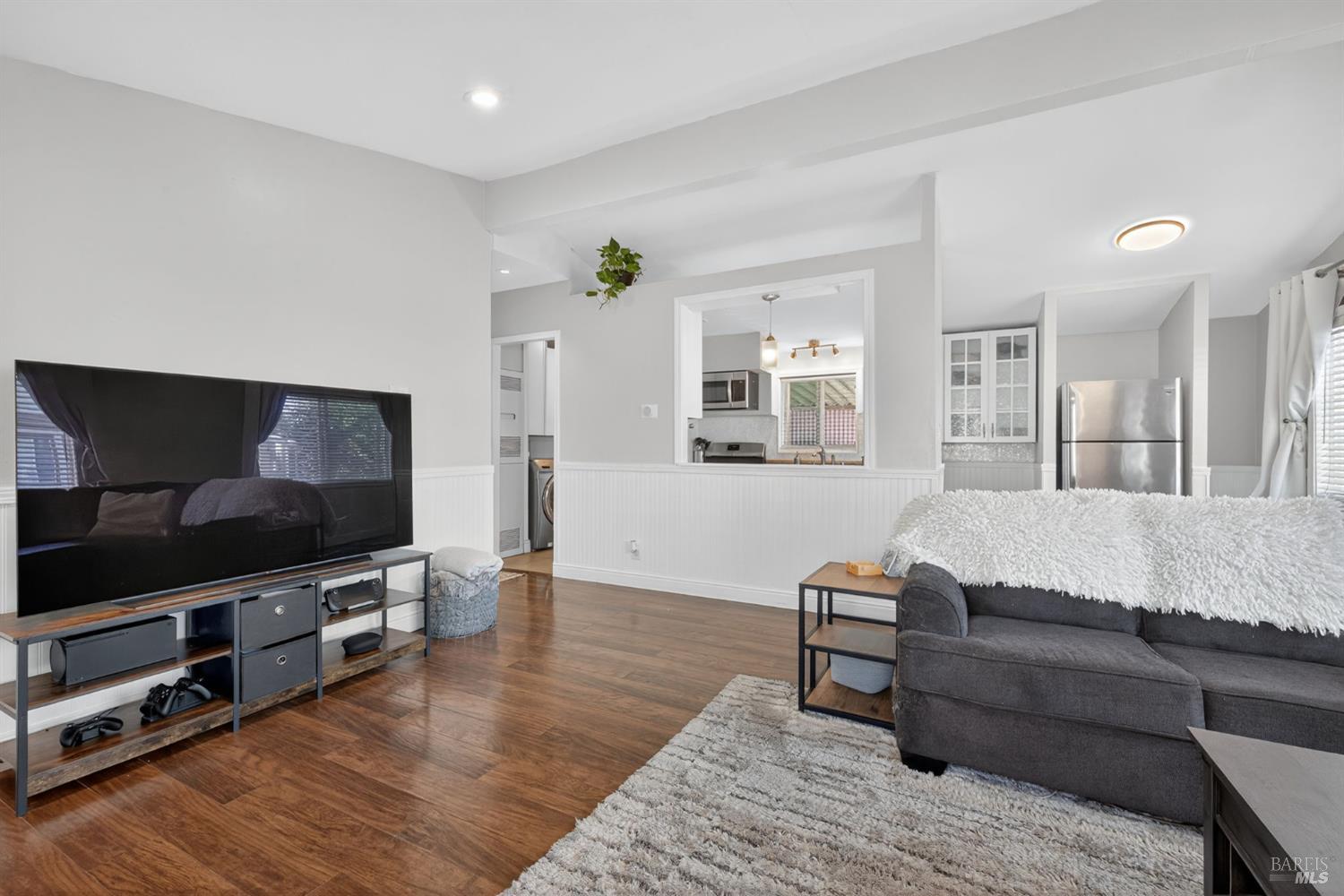 109 Pear Lane, Unit 109 Santa Rosa, CA 95407 - Photo 8 of 27 a living room with furniture and a flat screen tv
