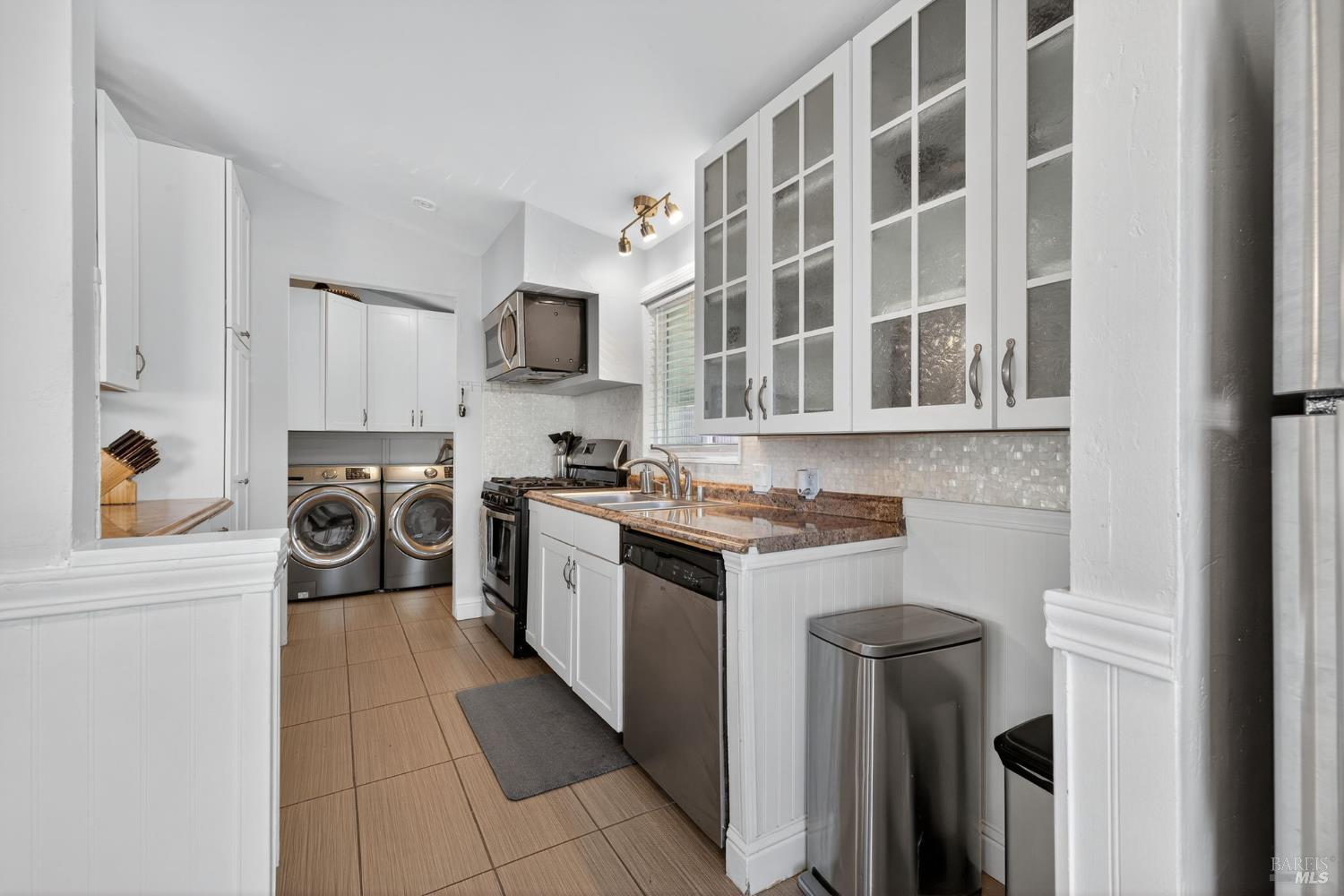 109 Pear Lane, Unit 109 Santa Rosa, CA 95407 - Photo 9 of 27 a kitchen with stainless steel appliances granite countertop a stove and a sink