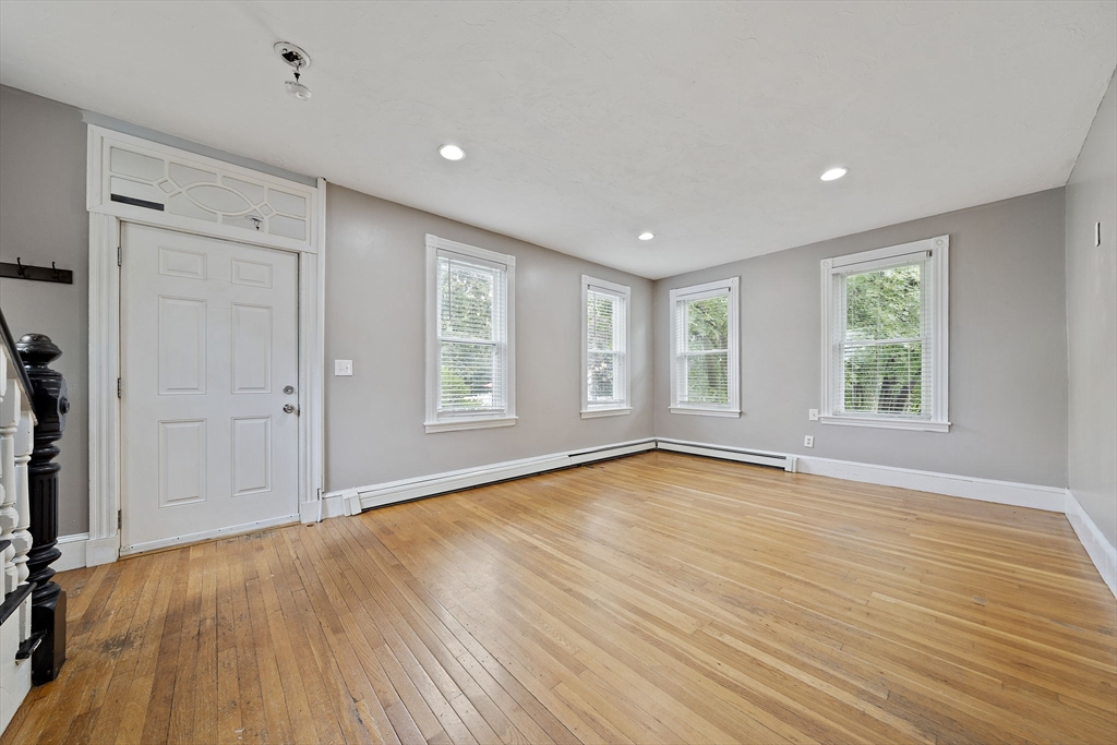 23 Reed Place Whitman, MA 02382 - Photo 14 of 35 an empty room with wooden floor and windows
