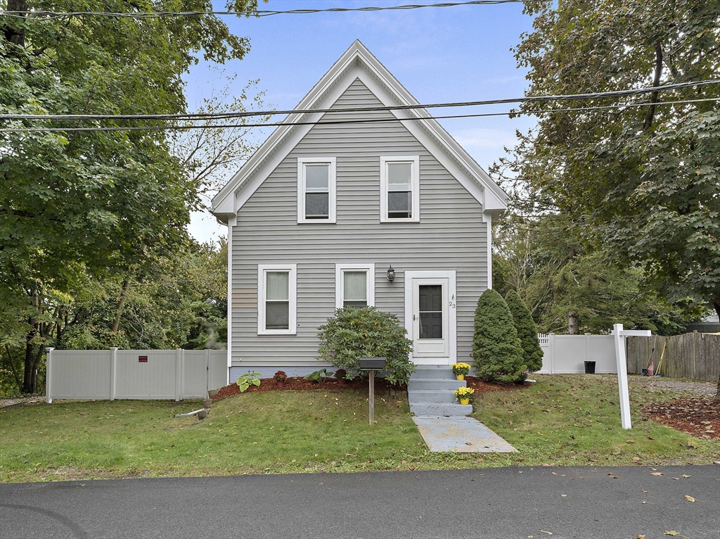 23 Reed Place Whitman, MA 02382 - Photo 2 of 35 a view of a house with a yard and a fence