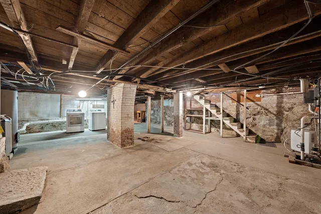 a view of empty room with wooden ceiling