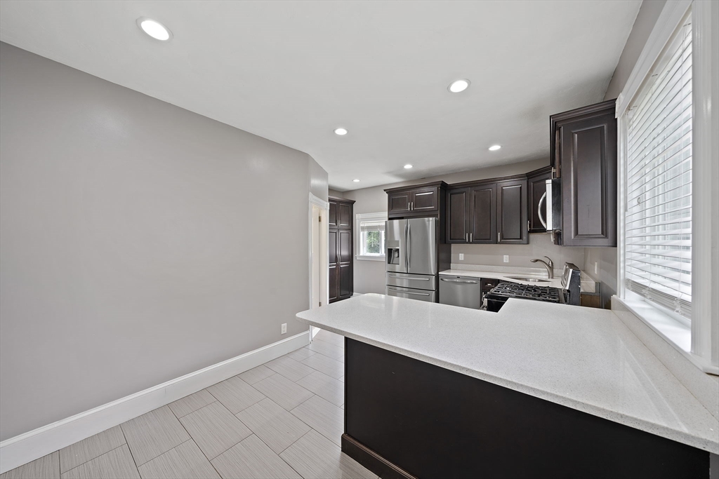 23 Reed Place Whitman, MA 02382 - Photo 7 of 35 a view of a kitchen with a sink