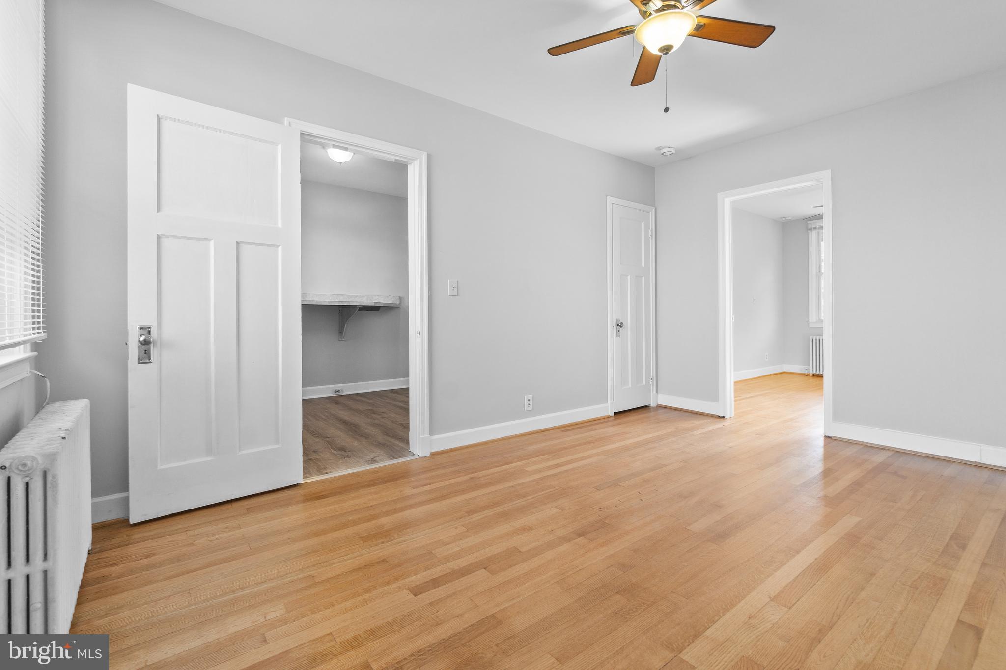 3572 Juneway, Unit 1 Baltimore, MD 21213 - Photo 2 of 23 wooden floor in an empty room with a window
