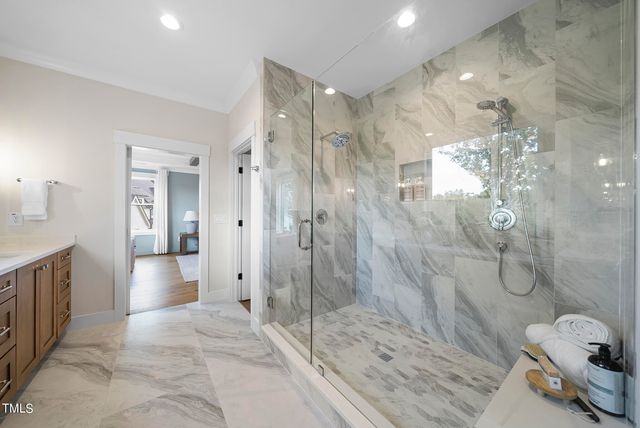 a bathroom with a shower and a tub