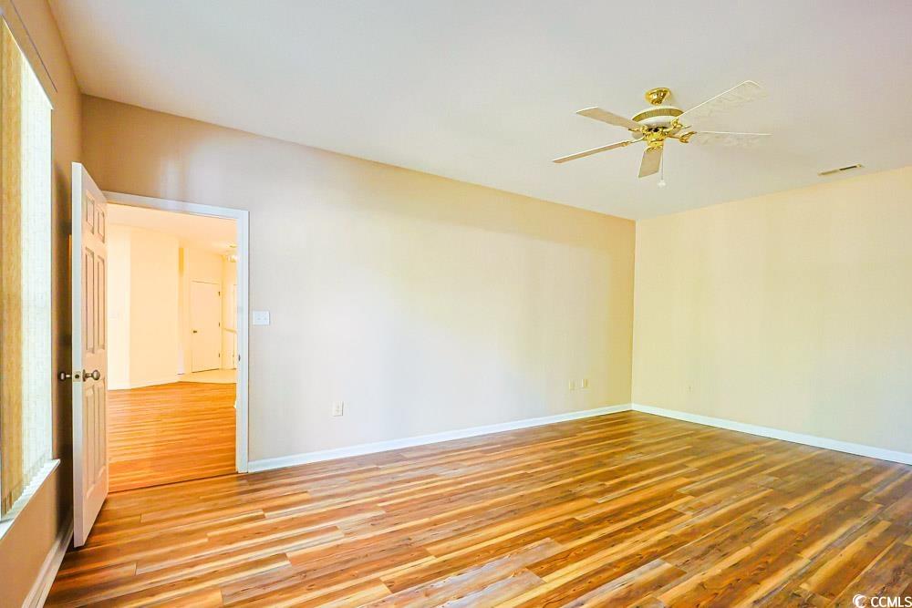 401 Pipers Lane, Unit 401 Myrtle Beach, SC 29575 - Photo 10 of 40 Unfurnished room featuring light wood-style flooring and ceiling fan