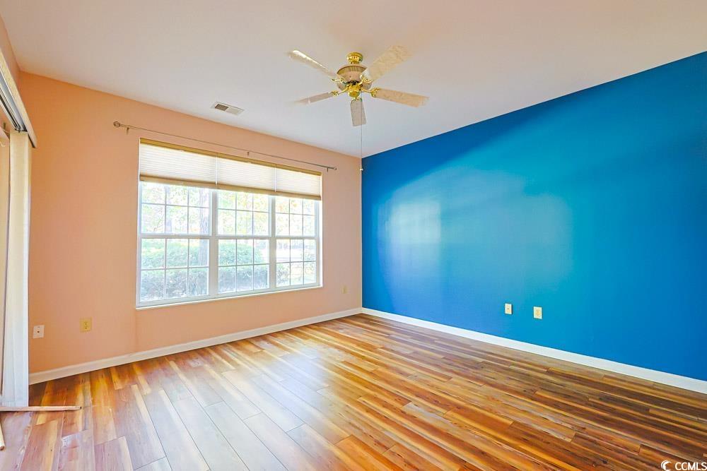 401 Pipers Lane, Unit 401 Myrtle Beach, SC 29575 - Photo 17 of 40 Unfurnished room featuring light wood finished floors and a ceiling fan