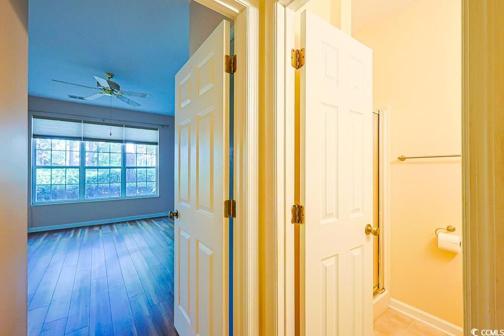 401 Pipers Lane, Unit 401 Myrtle Beach, SC 29575 - Photo 19 of 40 Corridor with baseboards and wood finished floors