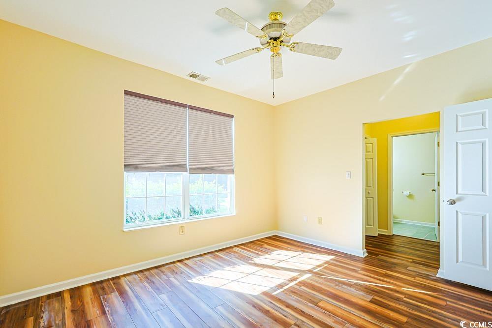 401 Pipers Lane, Unit 401 Myrtle Beach, SC 29575 - Photo 22 of 40 Empty room with hardwood / wood-style flooring and a ceiling fan