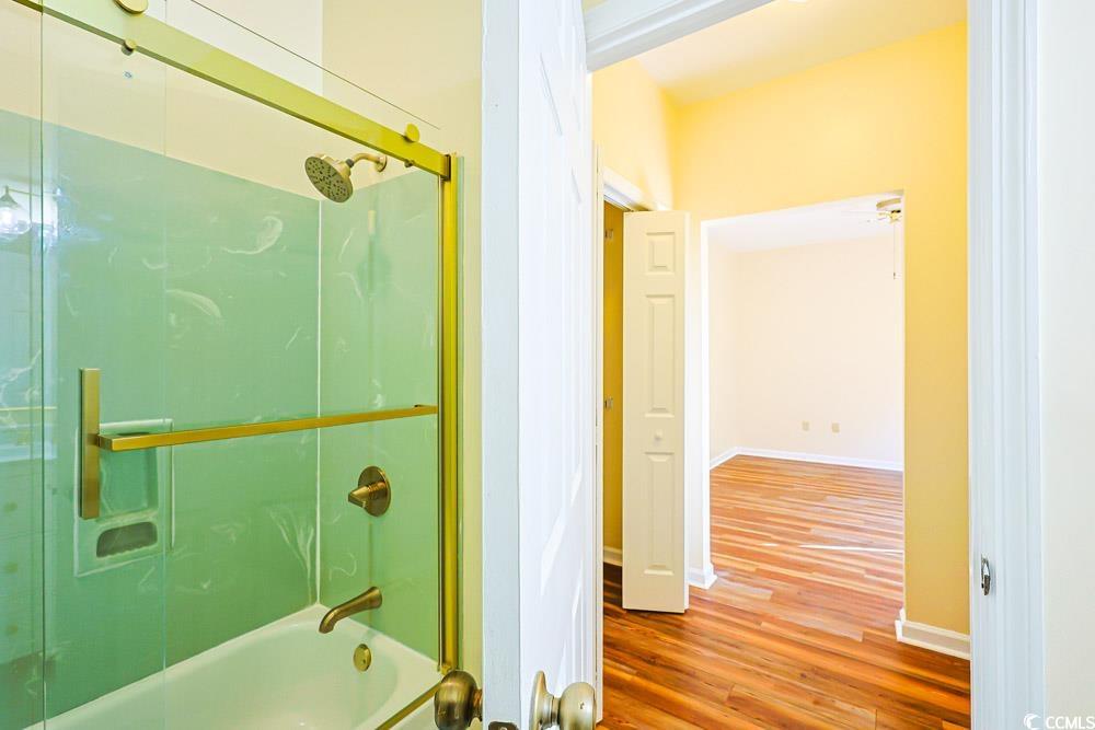 401 Pipers Lane, Unit 401 Myrtle Beach, SC 29575 - Photo 24 of 40 Bathroom with wood finished floors and bathtub / shower combination