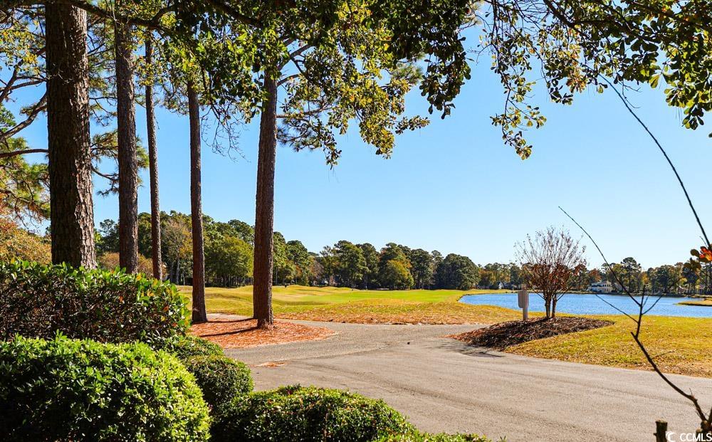 401 Pipers Lane, Unit 401 Myrtle Beach, SC 29575 - Photo 29 of 40 View of asphalt road featuring a water view and golf course view