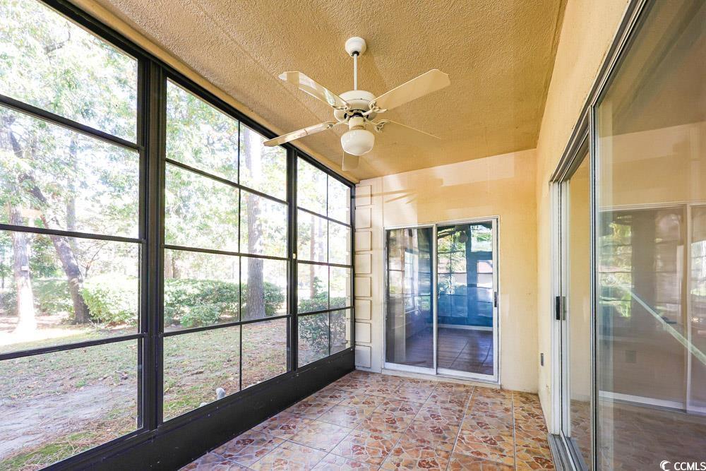 401 Pipers Lane, Unit 401 Myrtle Beach, SC 29575 - Photo 33 of 40 Unfurnished sunroom with a ceiling fan