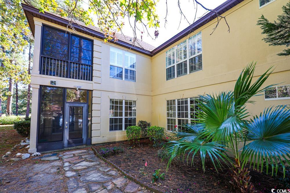 401 Pipers Lane, Unit 401 Myrtle Beach, SC 29575 - Photo 34 of 40 Back of house featuring stucco siding